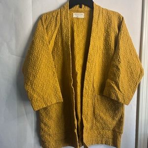 Curator Jules Cartigan Limited Mustard Color Waffle Quilted Pattern